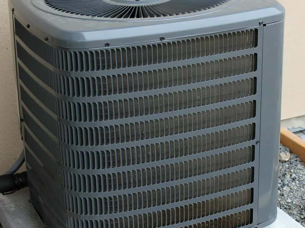 Outdoor air conditioner condenser unit outside a home